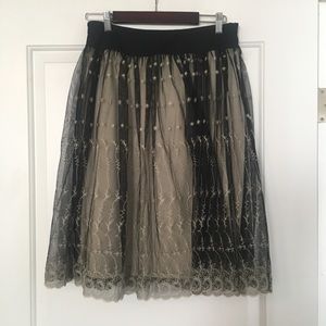 Sheer black skirt with embroidered flowers